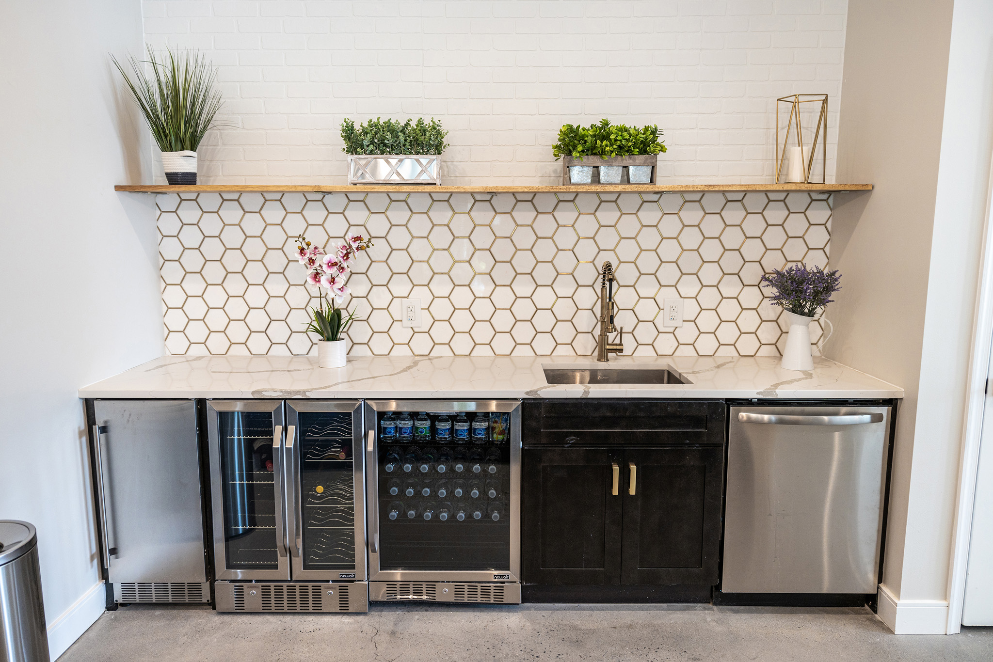 a kitchen with a sink and a counter top with appliances
